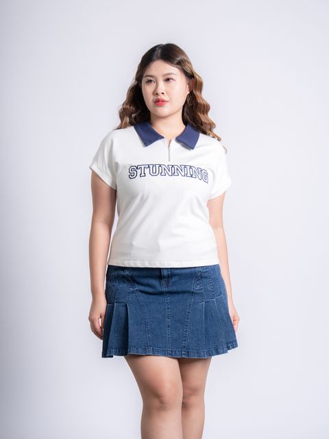 Curvy-friendly zip-up polo tee designed to shape and elongate the neckline.