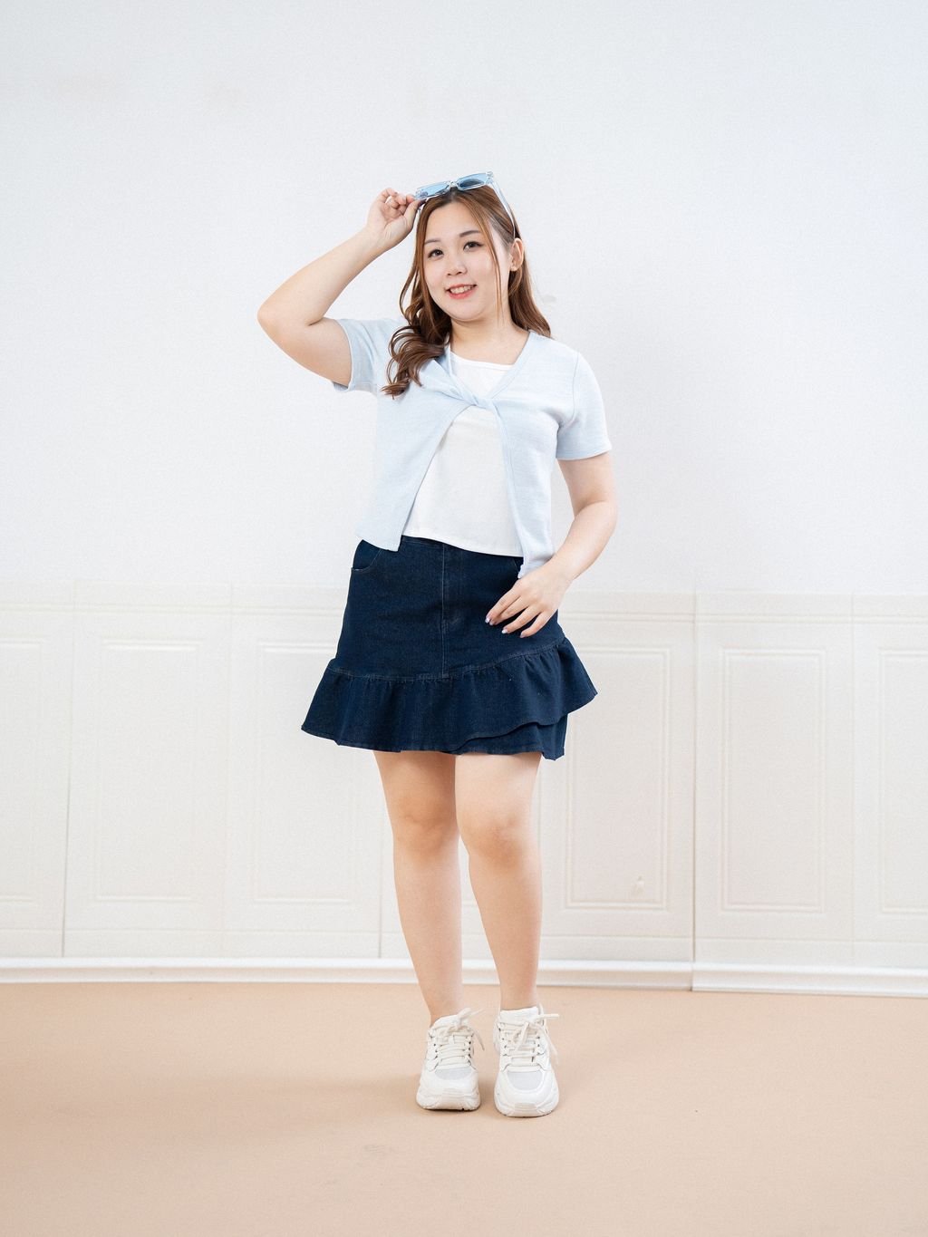 Lightweight plus size layering top in blue with twist front detail.