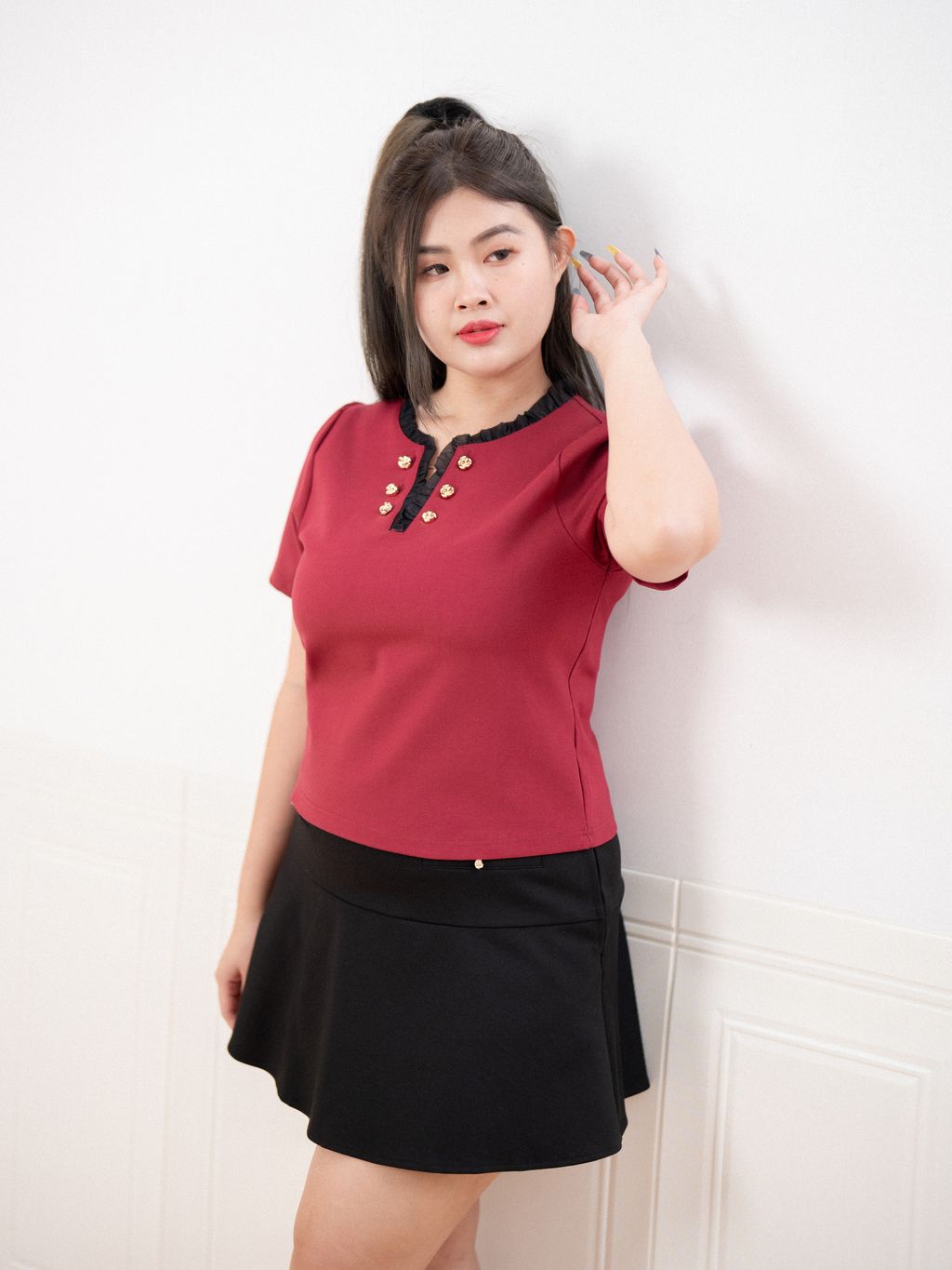 Elegant plus size top with stretch fabric and flattering silhouette for curves.