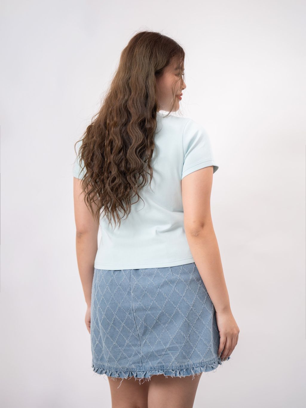 Back view of mint LOVE tee worn by model
