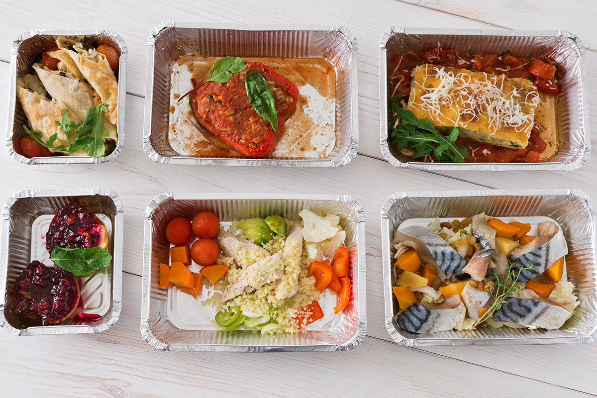 protein-carbs-food-take-away-in-boxes-top-view-on-wood