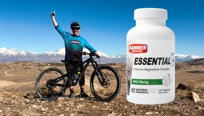 Essential Magnesium in next to smiling Hammer Athlete on Mountain Bike
