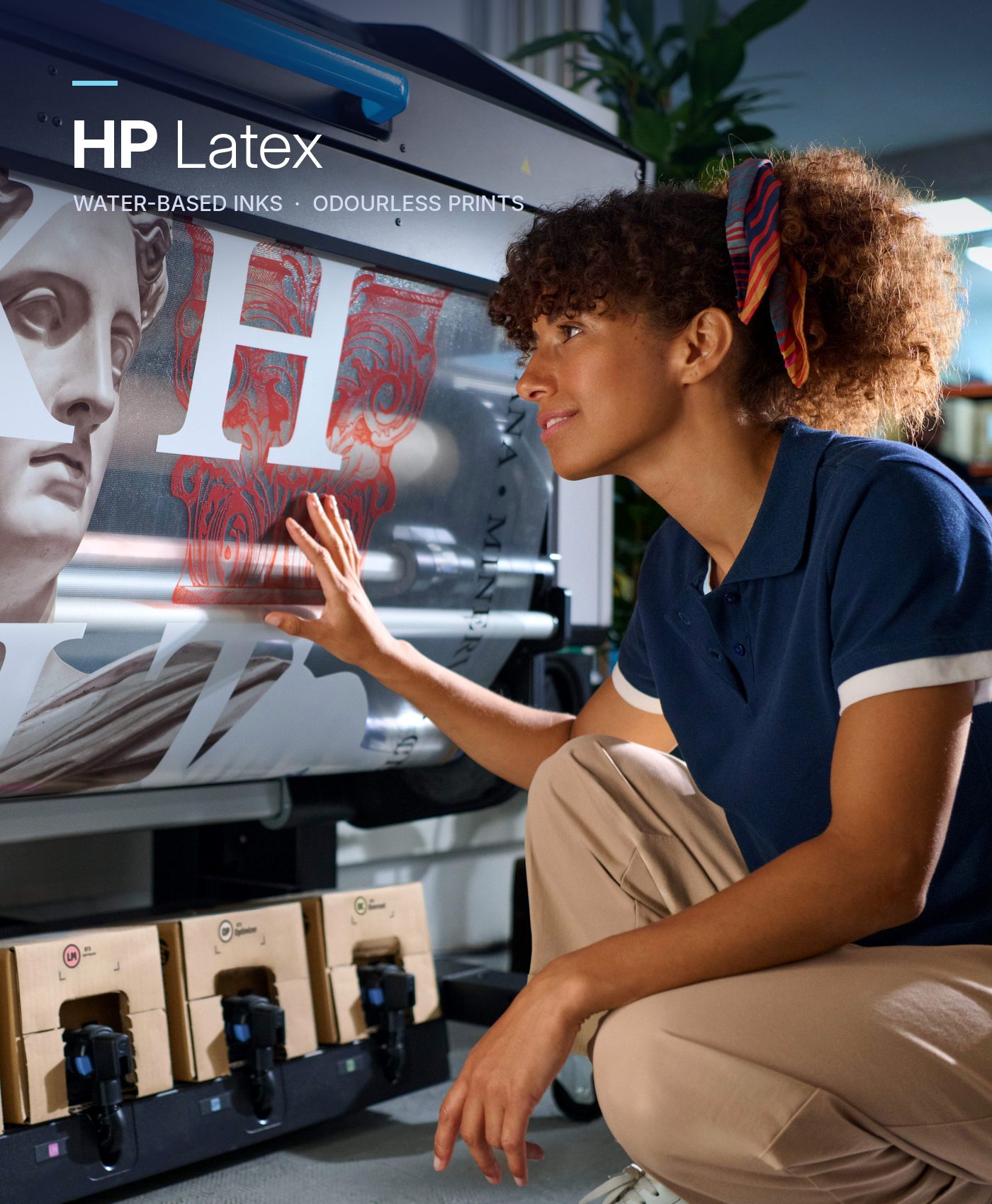 Print operator checking an HP Latex print on the printer