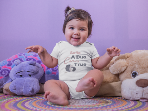 little-baby-girl-dancing-and-wearing-a-onesie-while-sitting-down-on-her-carpet-with-teddies-mockup-a14046.png