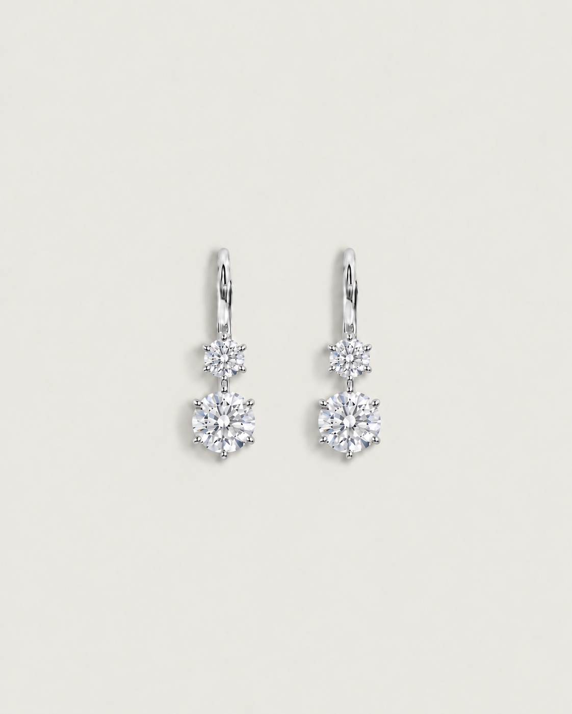 White gold hoops with six-prong stones