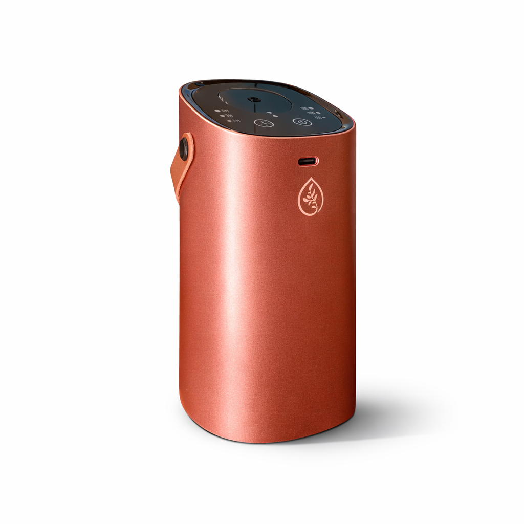 Pink waterless car diffuser dispersing essential oil mist – portable nebulizing diffuser for car aromatherapy