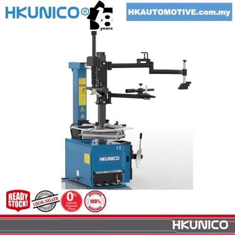 HKUNICO H522AA 22-inch Automatic Tyre Changer with Helper Arm operating in a tyre shop