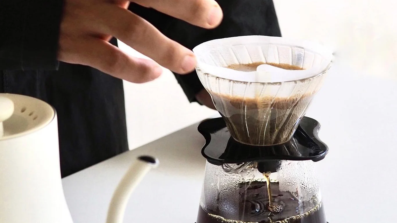 Pour-over coffee brewing in a glass V60 dripper