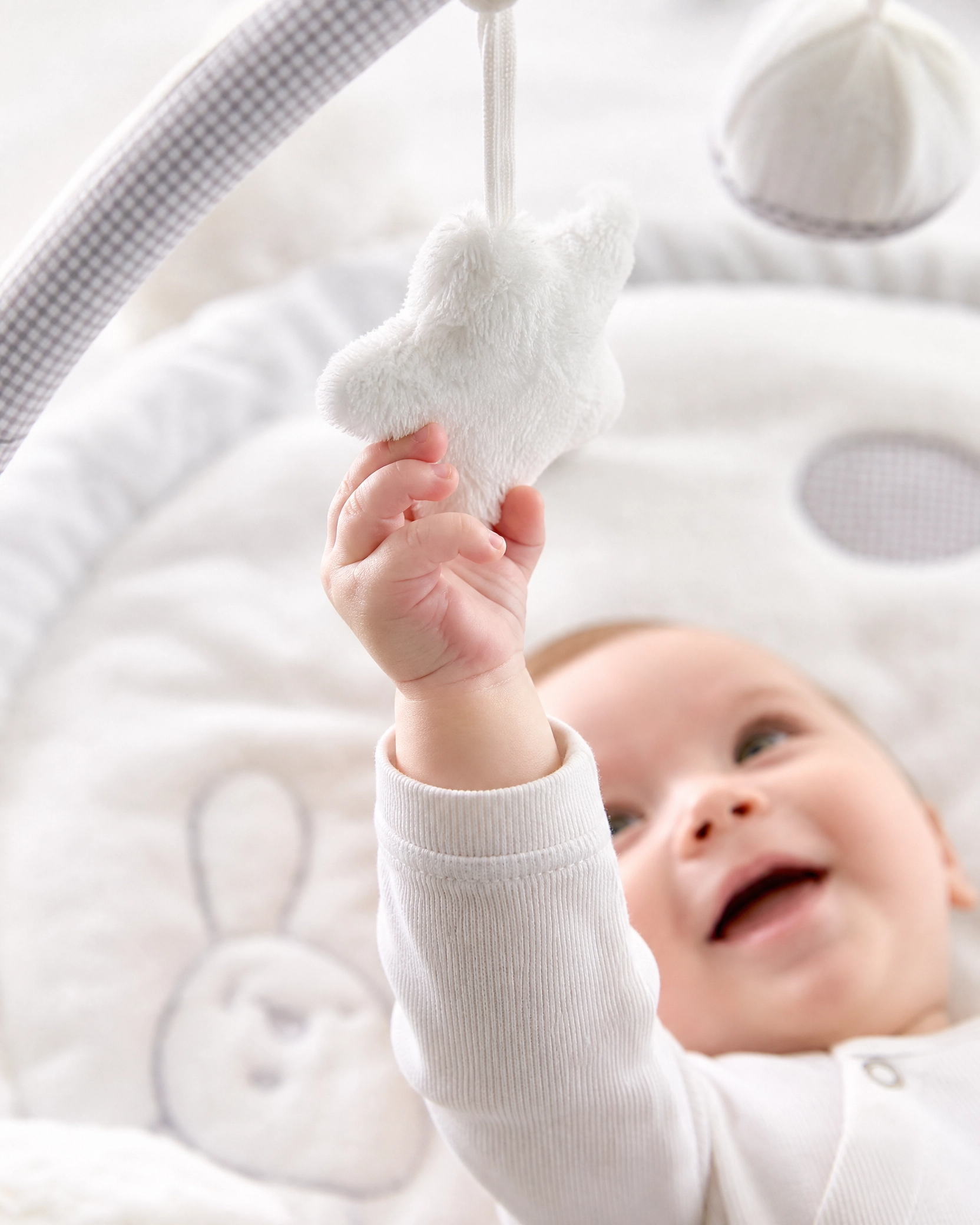white_baby_gym_hand_close_up