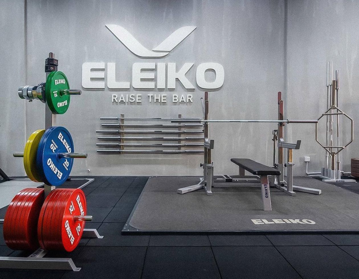 Eleiko wall sign, plate tree and bench in the first Zealfit showroom