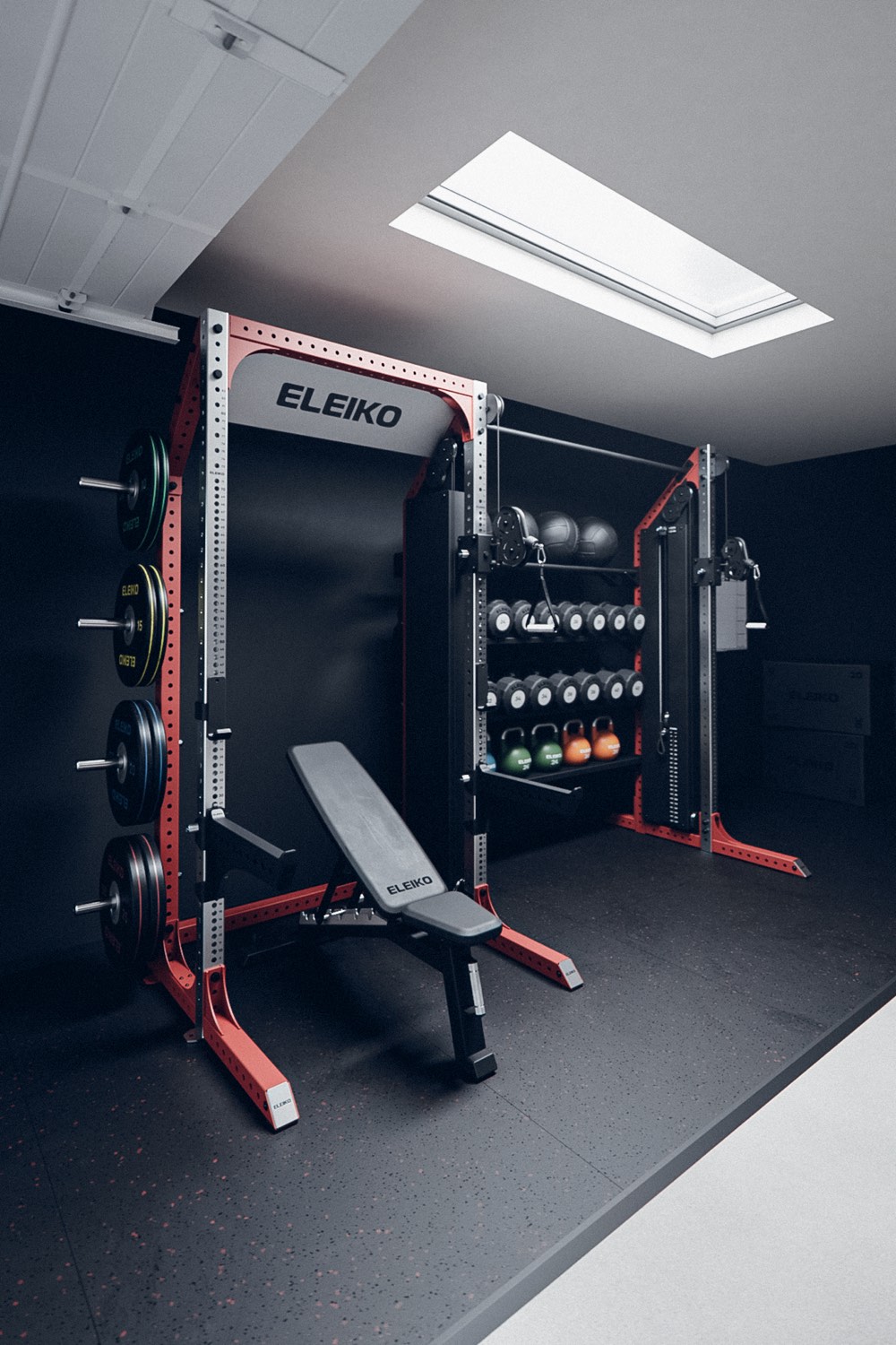 A dark home gym under a skylight with a red-trimmed Eleiko rack