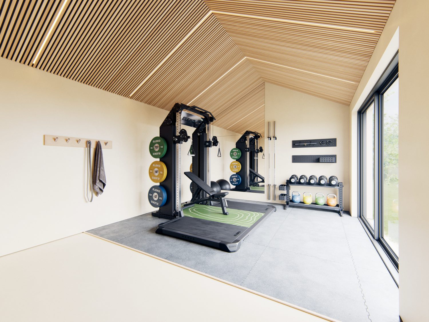A bright attic home gym with two Eleiko racks, a bench and a dumbbell rack