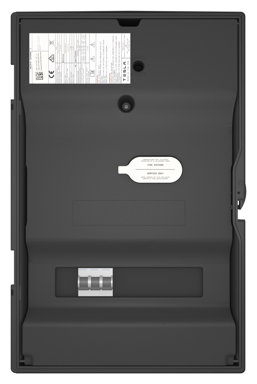 Tesla Backup Gateway 打開門蓋後的面板：左上是零件編號與序號標籤，中間是貼著 SERVICE ONLY 保護標籤的手動覆寫開關，下方是斷路器