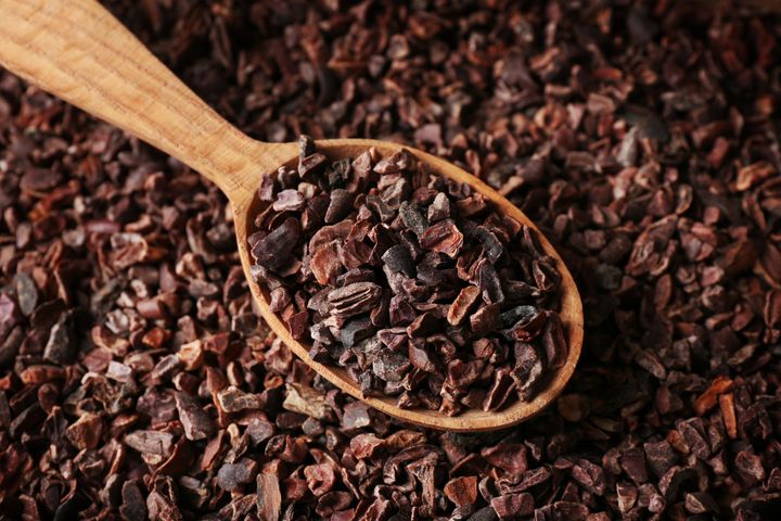 heap-cocoa-nibs-wooden-spoon-closeup