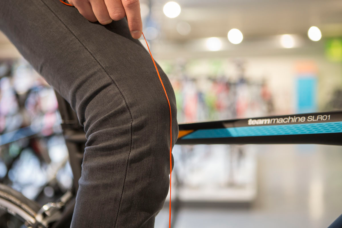Hold the plump line steadily just above your knee. Hold the plump line steadily just above your knee.