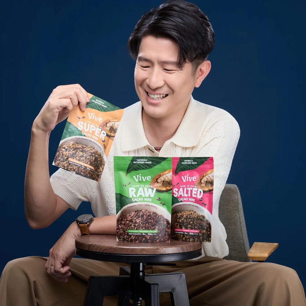 Eric Khor, founder of VIVE Chocolate, holding a pack of Mess Bites