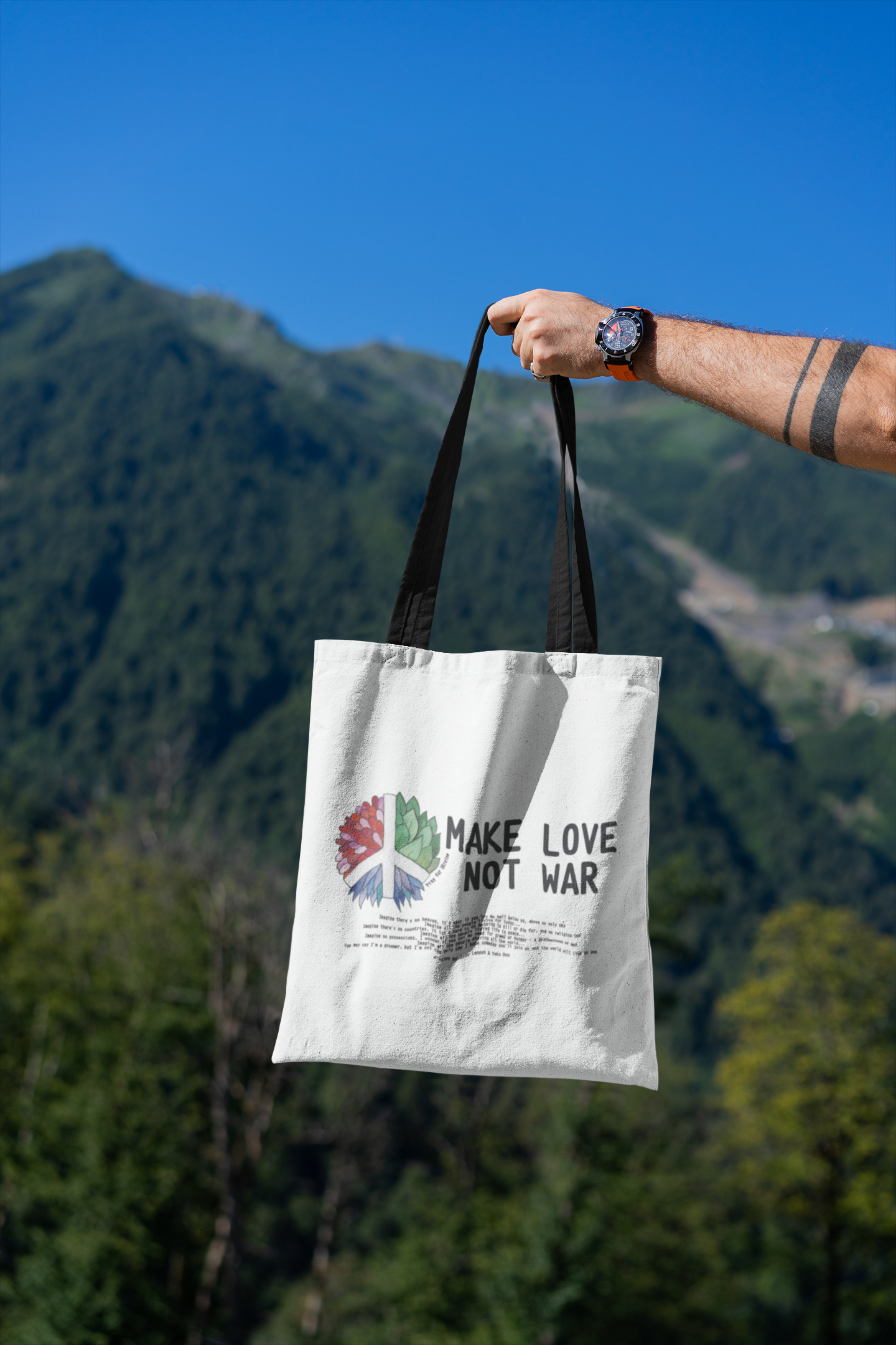 mockup-featuring-a-man-s-hand-holding-a-tote-bag-against-a-natural-scenery-3131-el1 (7).png