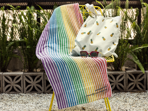 towel-mockup-on-a-chair-with-a-pineapple-printed-bag-and-sunglasses-lying-on-it-a14899 (3).png