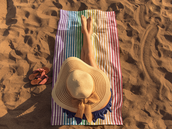 girl-sunbathing-on-a-beach-towel-template-a14887 (1).png