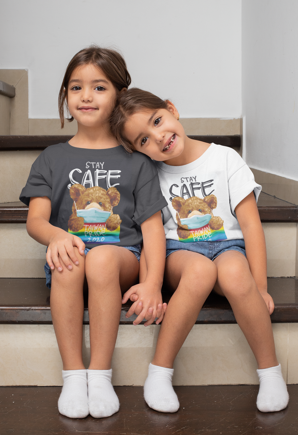 t-shirt-mockup-of-twin-girls-sitting-on-the-stairs-31020.png