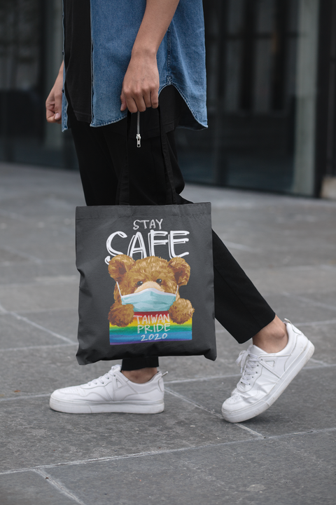 cropped-face-mockup-of-a-man-holding-a-tote-bag-in-the-street-29424 (3).png