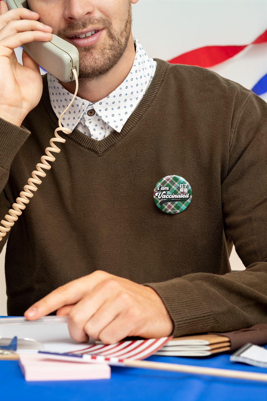 button-mockup-of-a-man-talking-on-the-phone-at-a-political-polling-station-31921.png