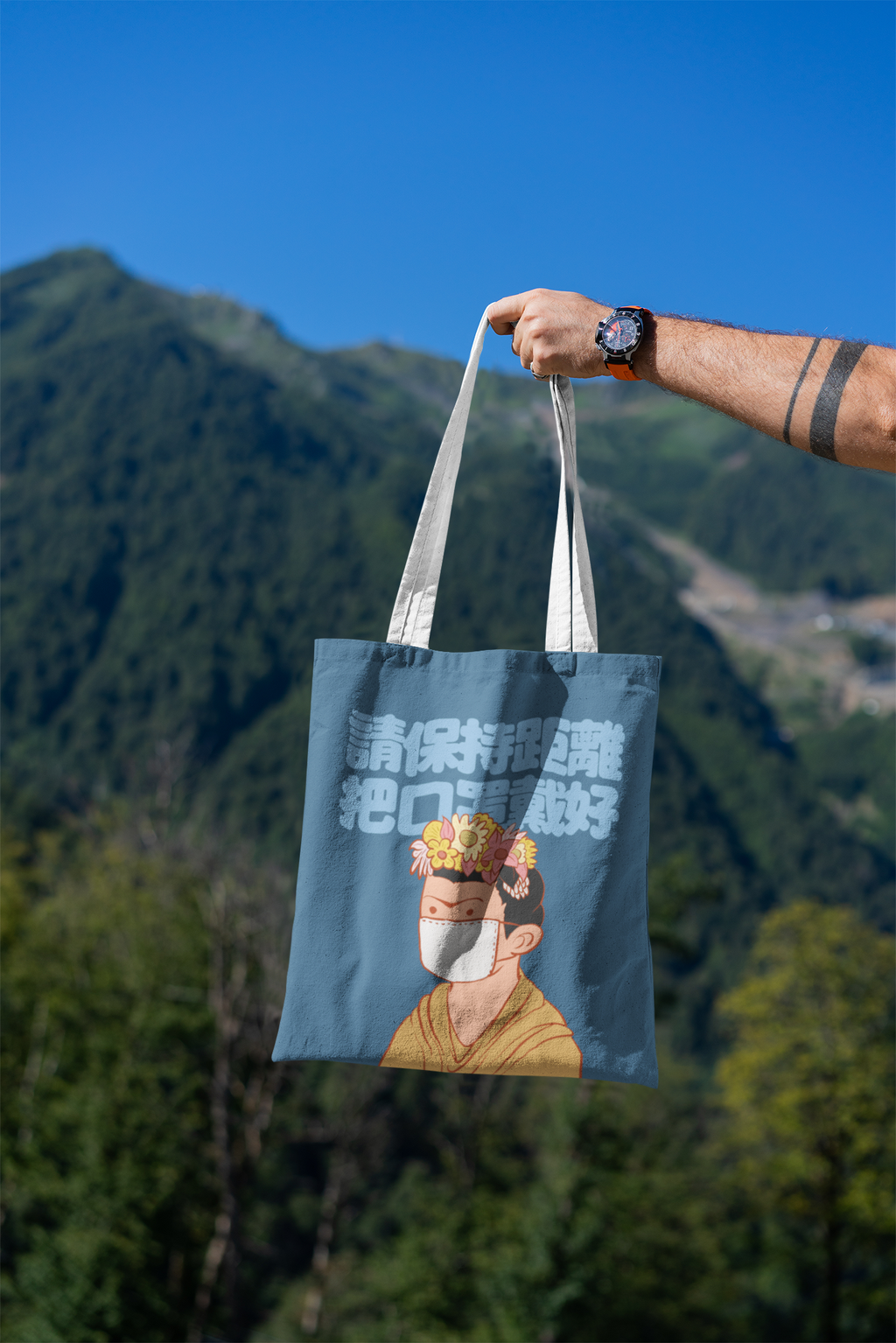 mockup-featuring-a-man-s-hand-holding-a-tote-bag-against-a-natural-scenery-3131-el1 (34).png