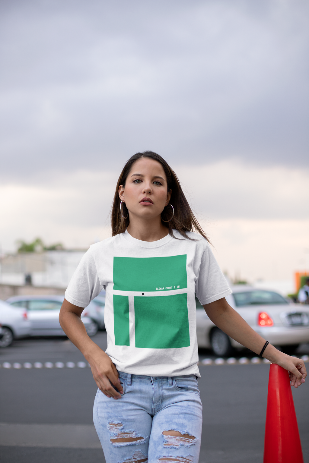 unisex-tee-mockup-of-a-woman-in-a-mall-parking-lot-23066 (1).png