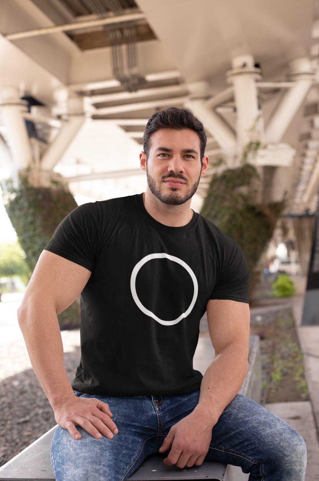 t-shirt-mockup-of-a-muscular-man-sitting-on-a-bench-in-the-city-28516.png