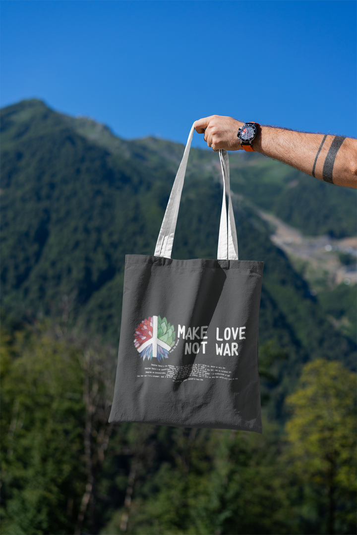mockup-featuring-a-man-s-hand-holding-a-tote-bag-against-a-natural-scenery-3131-el1 (6).png
