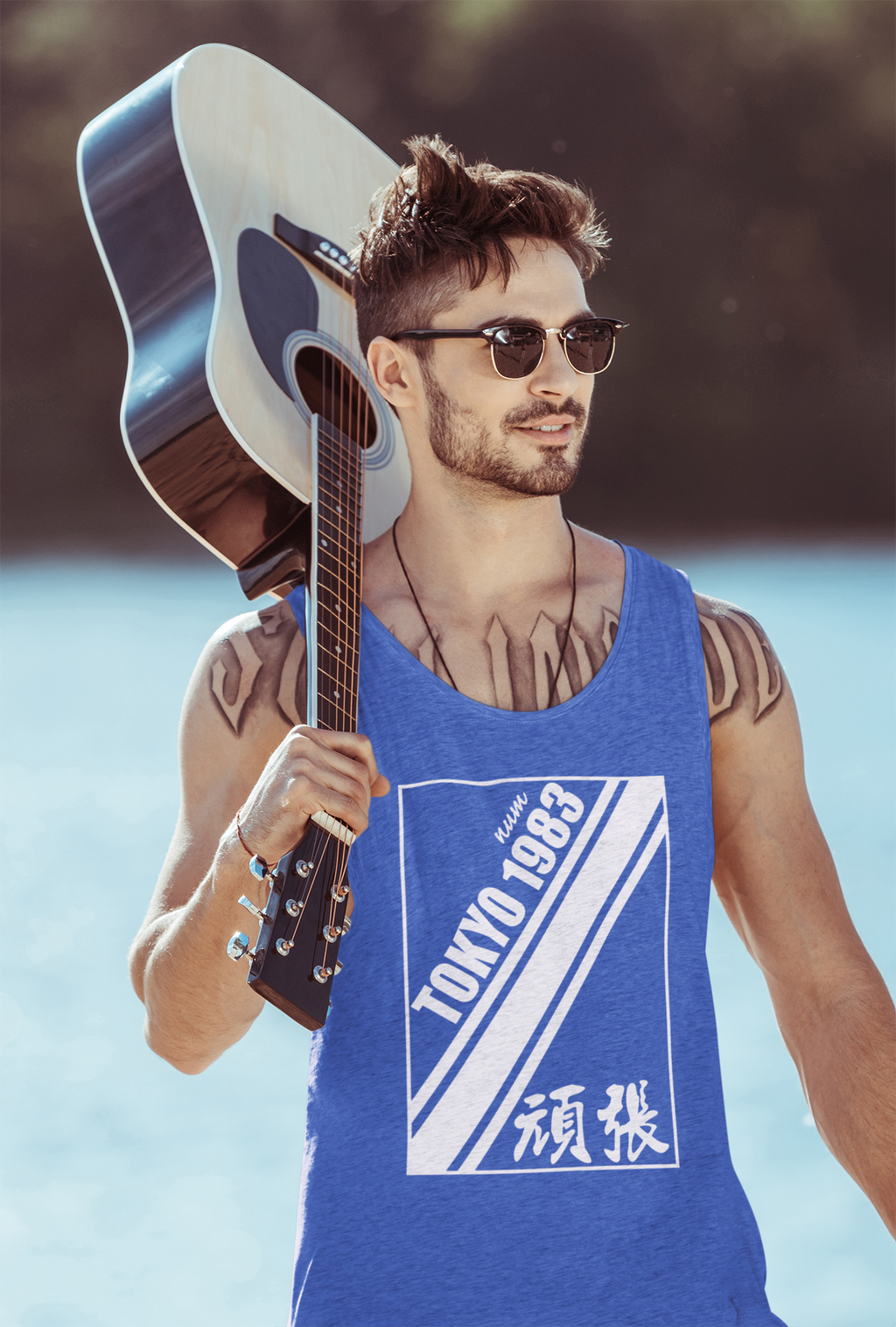 heather-tank-top-mockup-featuring-a-man-with-a-guitar-walking-by-a-lake-43901-r-el2.png