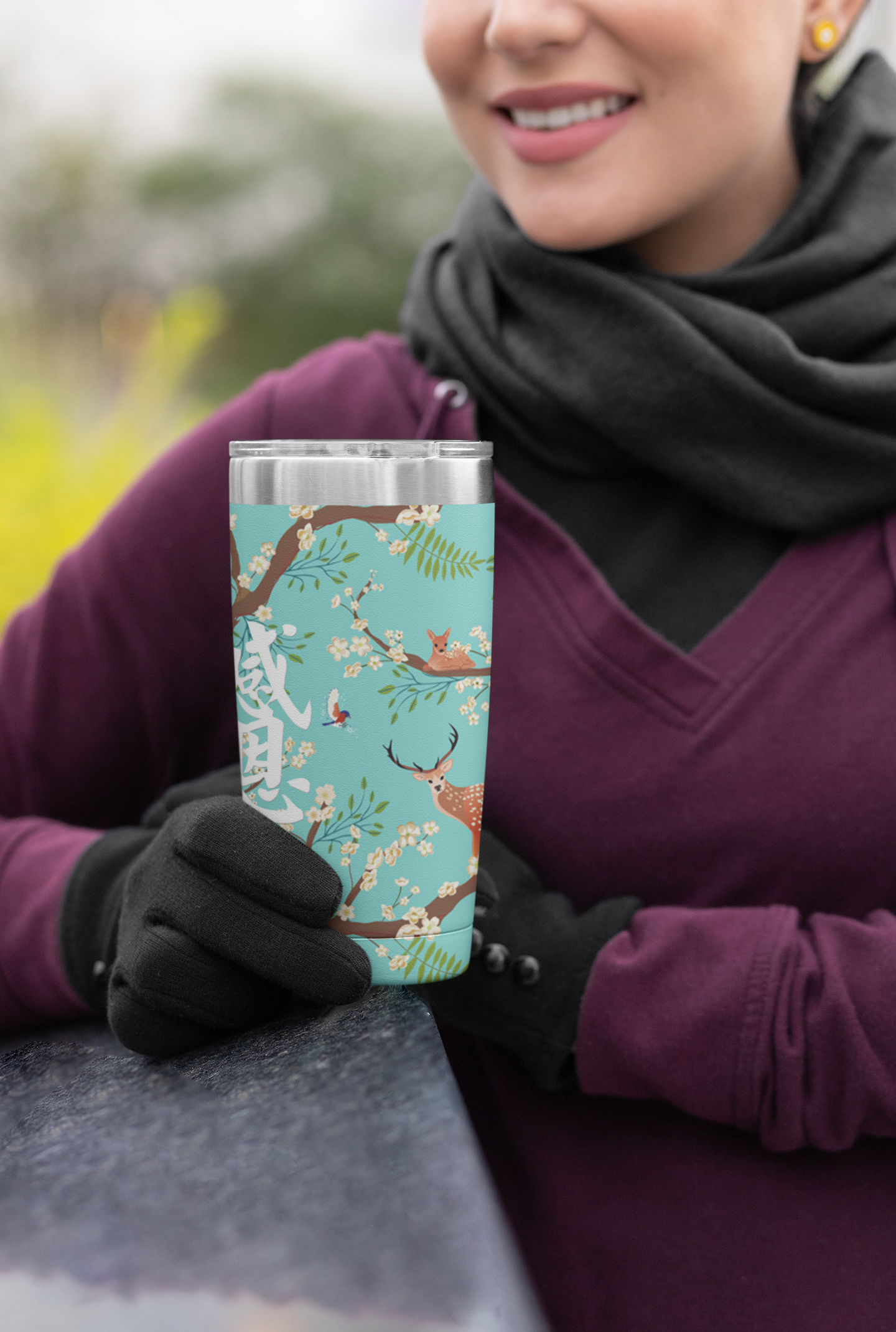 mockup-of-a-woman-in-winter-clothing-holding-a-20-oz-travel-mug-30411.png