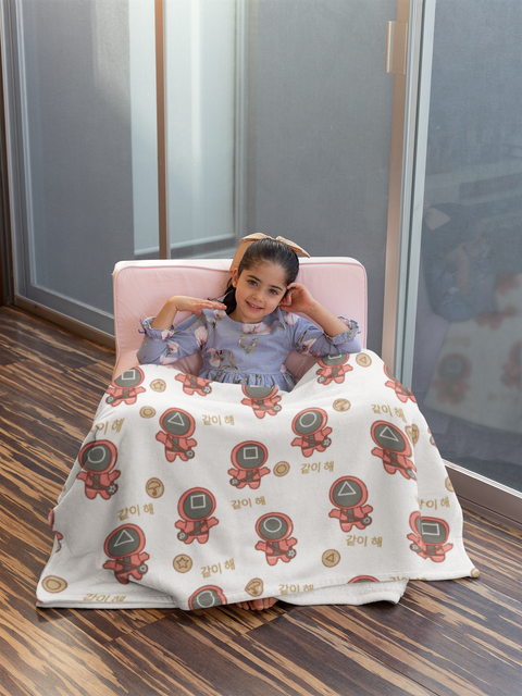 blanket-mockup-of-a-girl-in-a-cute-little-pink-sofa-24689.png