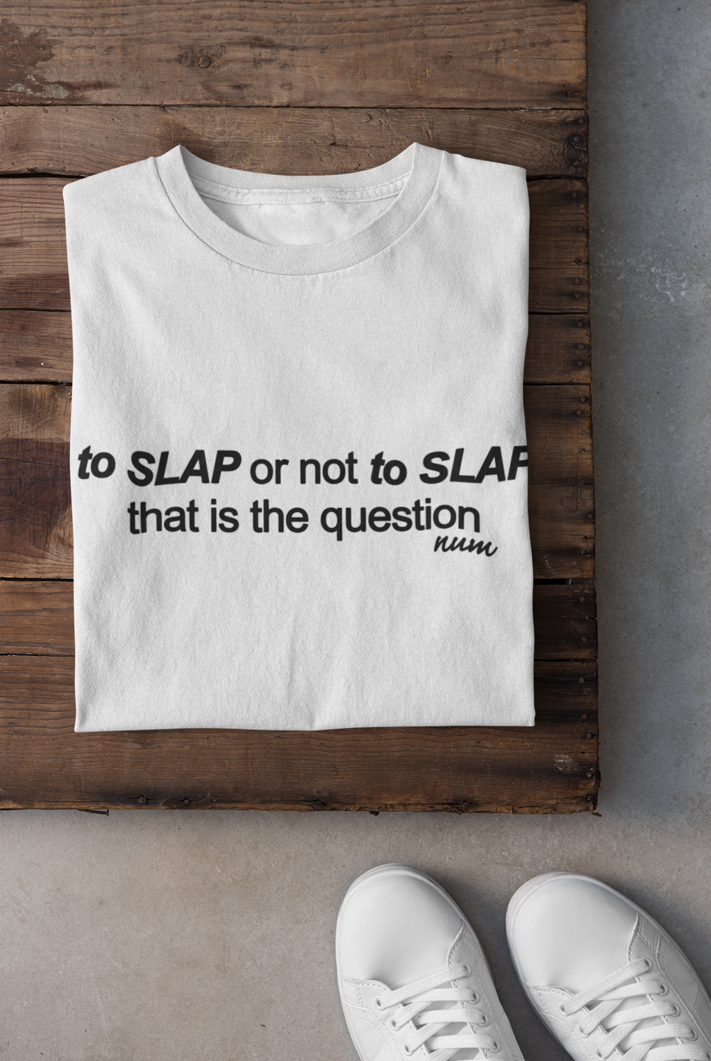 folded-tee-mockup-against-a-wooden-surface-33685.png