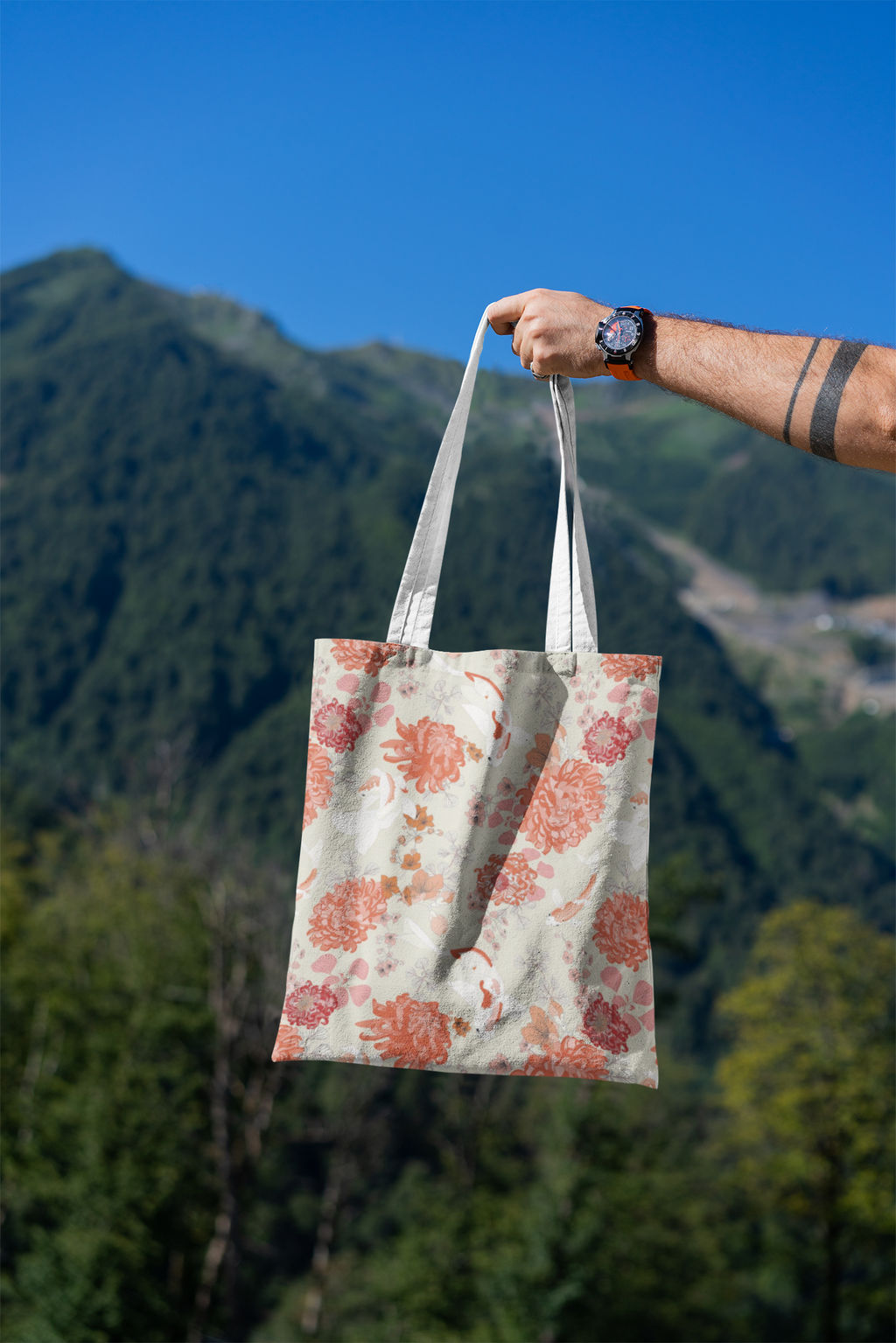 mockup-featuring-a-man-s-hand-holding-a-tote-bag-against-a-natural-scenery-3131-el1 (10).png