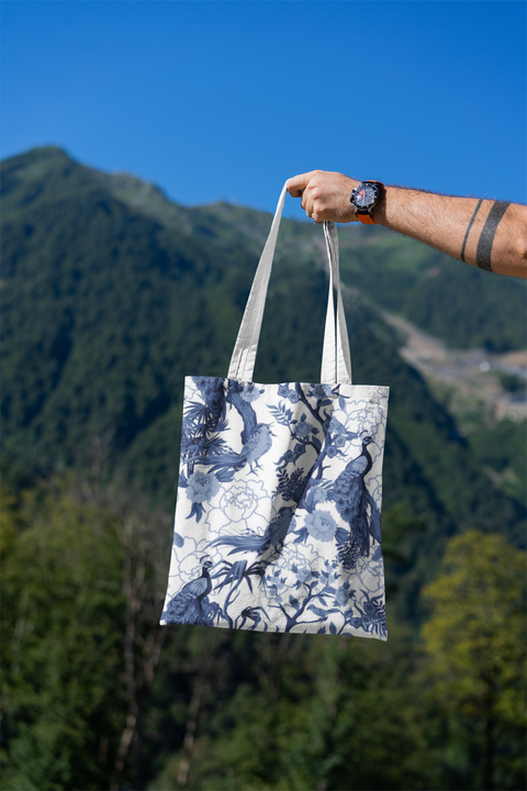 mockup-featuring-a-man-s-hand-holding-a-tote-bag-against-a-natural-scenery-3131-el1 (14).png