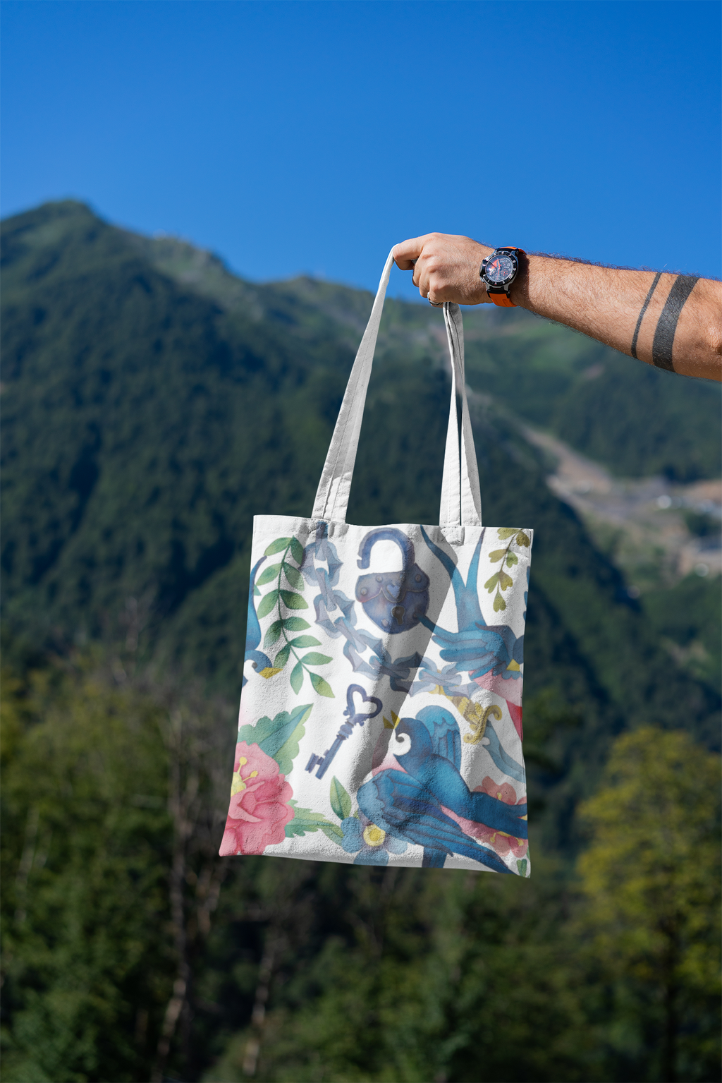 mockup-featuring-a-man-s-hand-holding-a-tote-bag-against-a-natural-scenery-3131-el1 (10).png