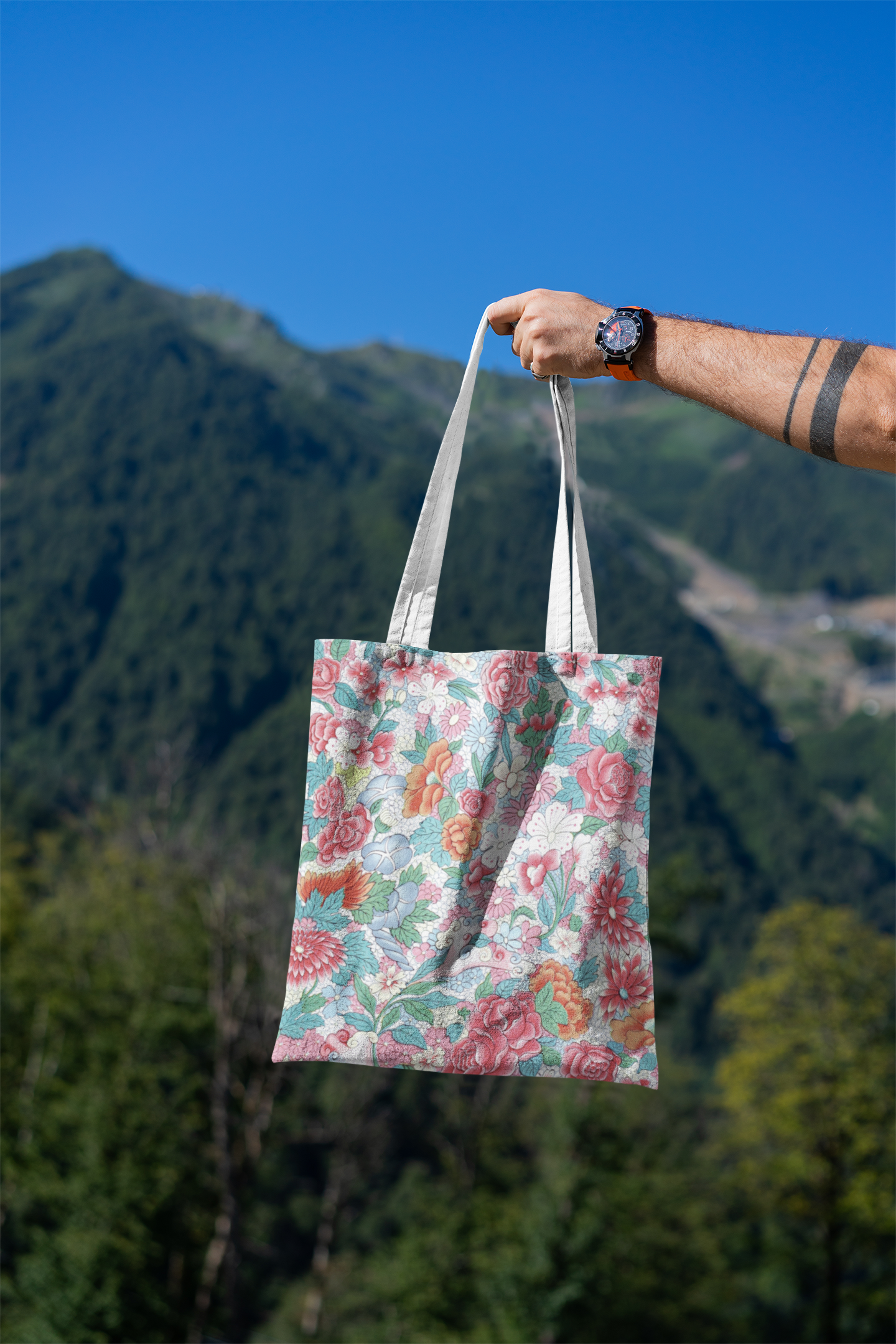 mockup-featuring-a-man-s-hand-holding-a-tote-bag-against-a-natural-scenery-3131-el1 (11).png