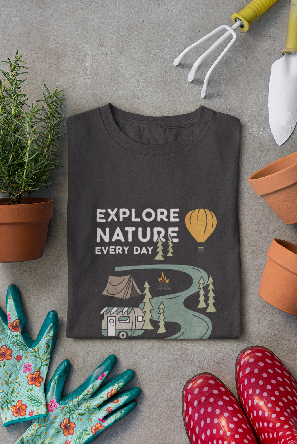 mockup-of-a-folded-t-shirt-surrounded-by-gardening-tools-33635.png