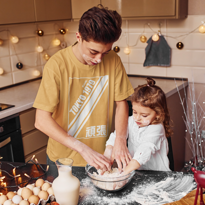 basic-t-shirt-mockup-of-teenage-boy-baking-with-his-little-sister-m2202-r-el2.png