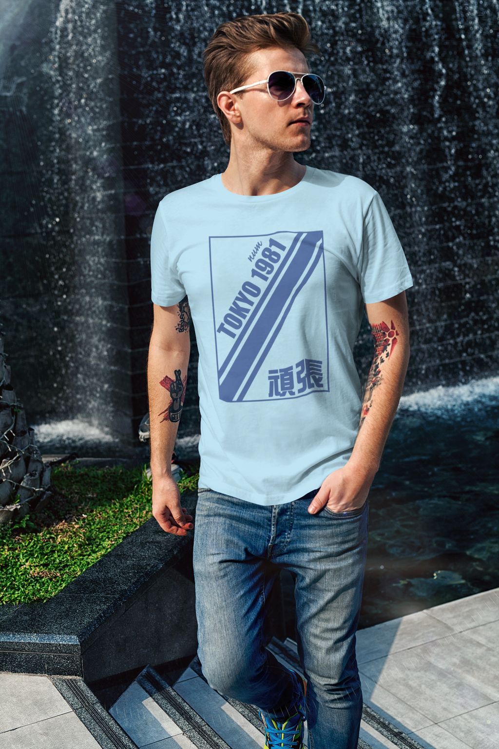 t-shirt-mockup-of-a-cool-man-walking-by-a-fountain-2190-el1.png