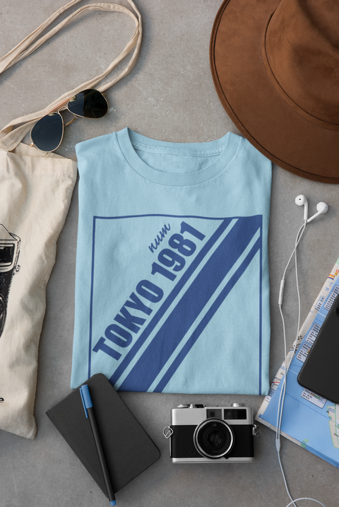 mockup-of-a-folded-t-shirt-placed-between-some-accessories-33794.png