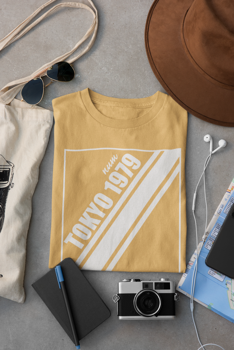 mockup-of-a-folded-t-shirt-placed-between-some-accessories-33794 (2).png