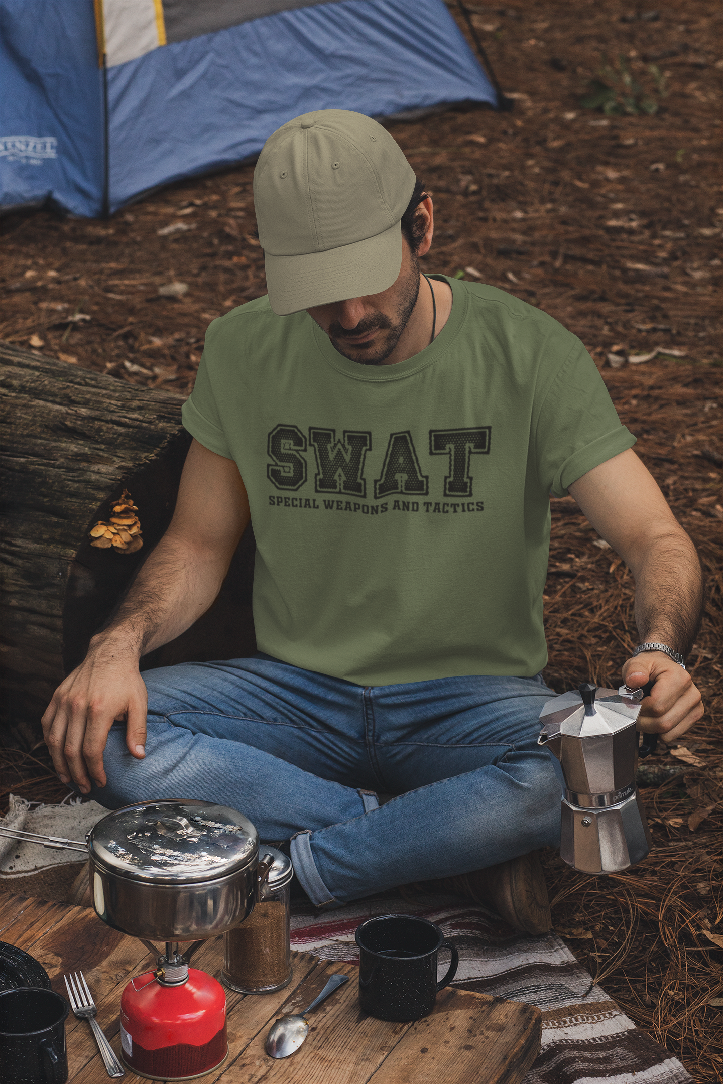 t-shirt-and-dad-hat-mockup-of-a-man-making-coffee-in-a-camping-site-30476.png