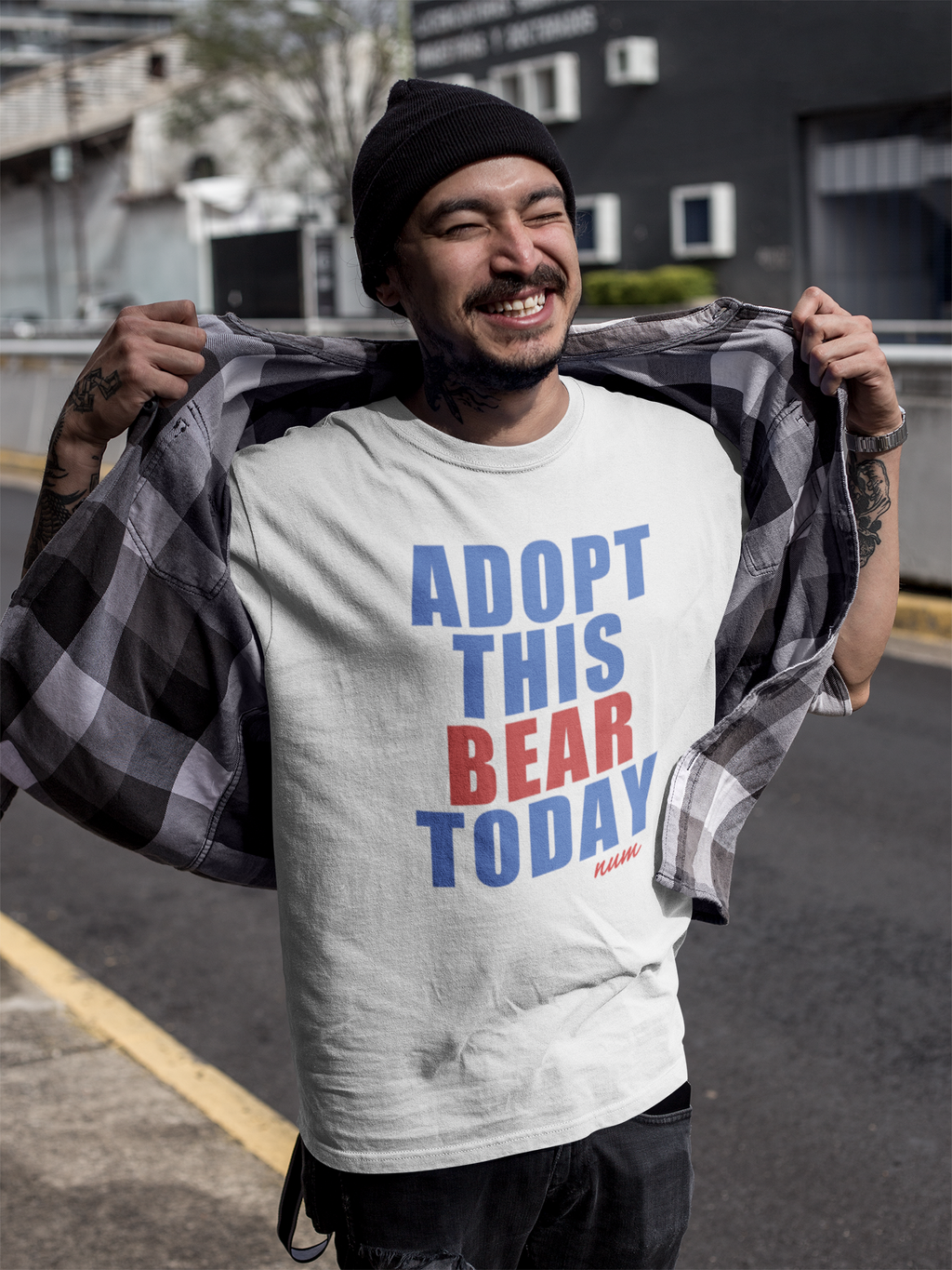 smiling-tattooed-asian-man-wearing-a-round-neck-t-shirt-mockup-outdoors-a17067.png