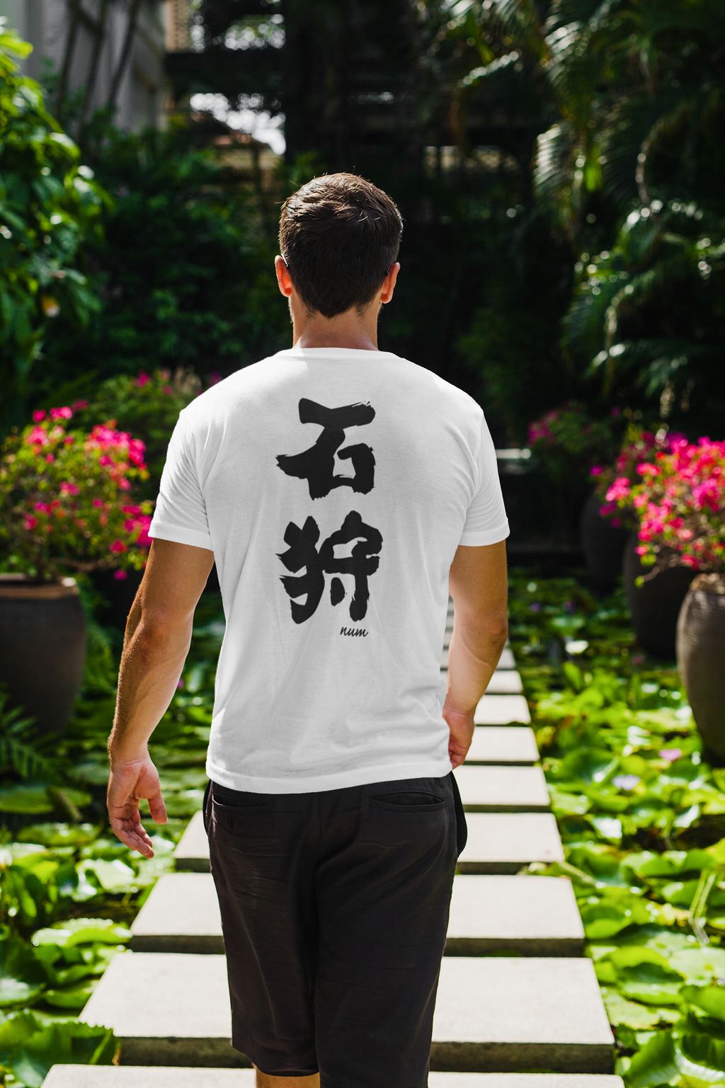 back-view-t-shirt-mockup-of-a-man-walking-through-a-tropical-hallway-2255-el1 (1).png