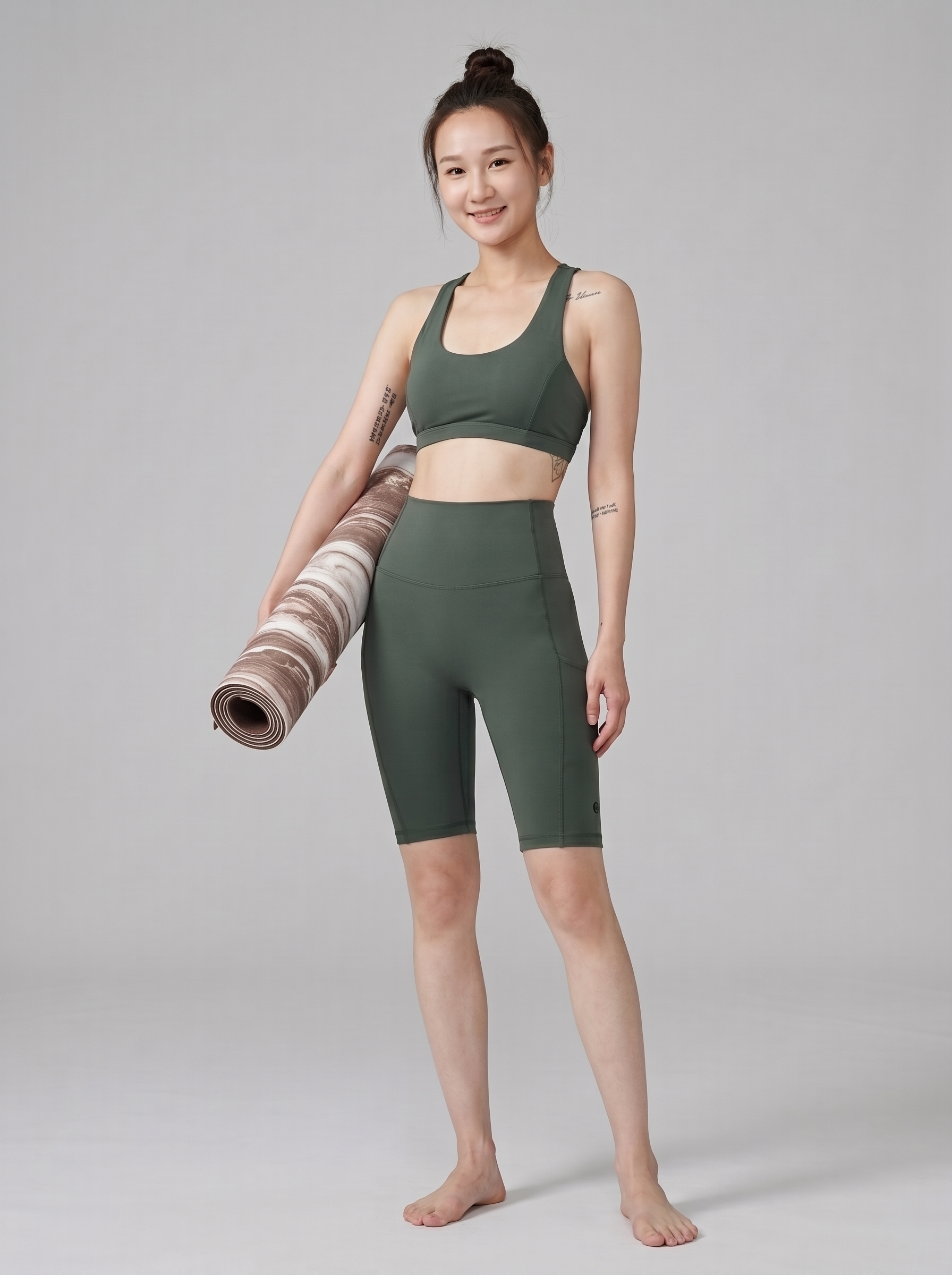 Person_standing_with_yoga_mat_202608120047