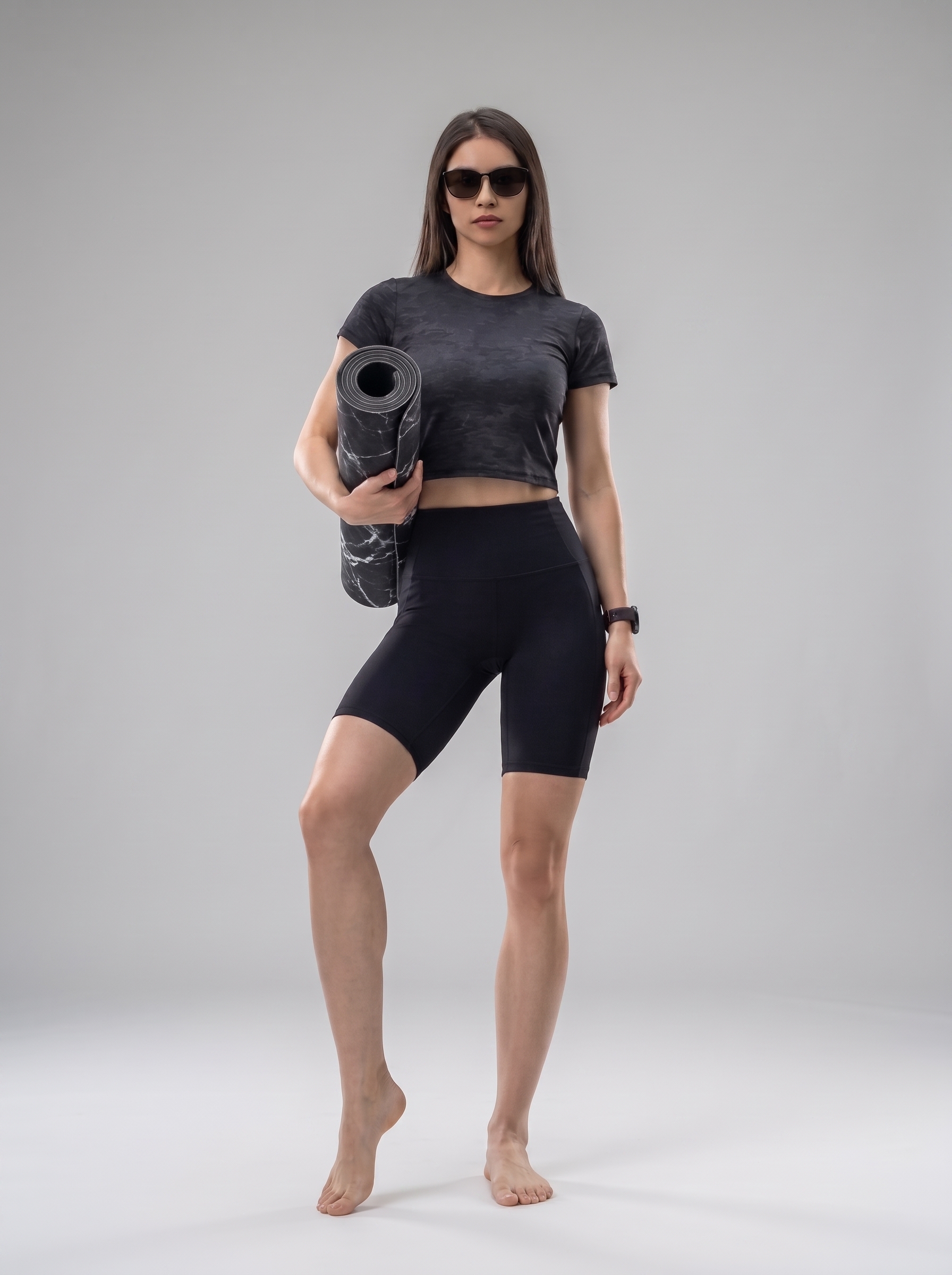 Person_holding_yoga_mat_2K_202608122051