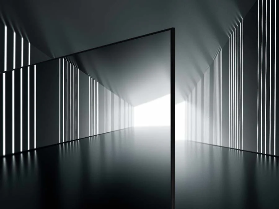 Description: A bezeless design of the Crystal UHD TV is on display at the center of what seems like a long tunnel. 