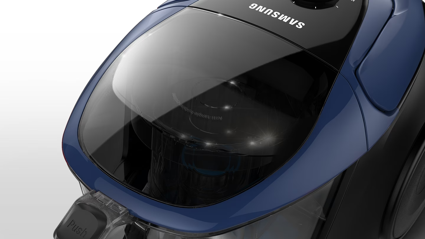 Description: Samsung canister vacuum cleaner can hold 2L of dust and dirt with its large capacity dustbin. A close-up view of the dustbin inside of the vacuum, dynamic view.